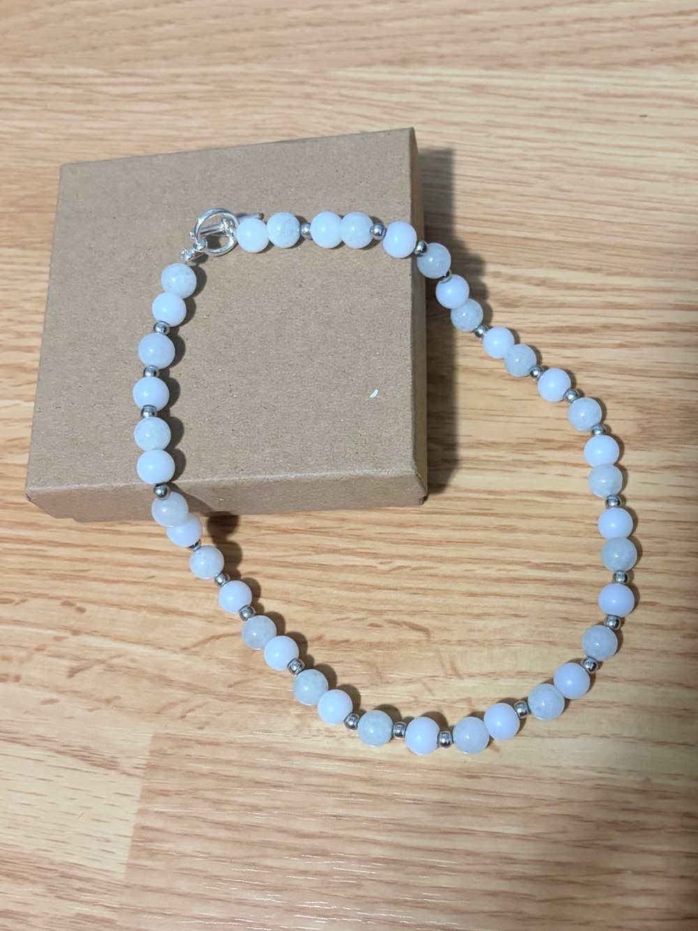Olive green and white beaded necklace with silver accents